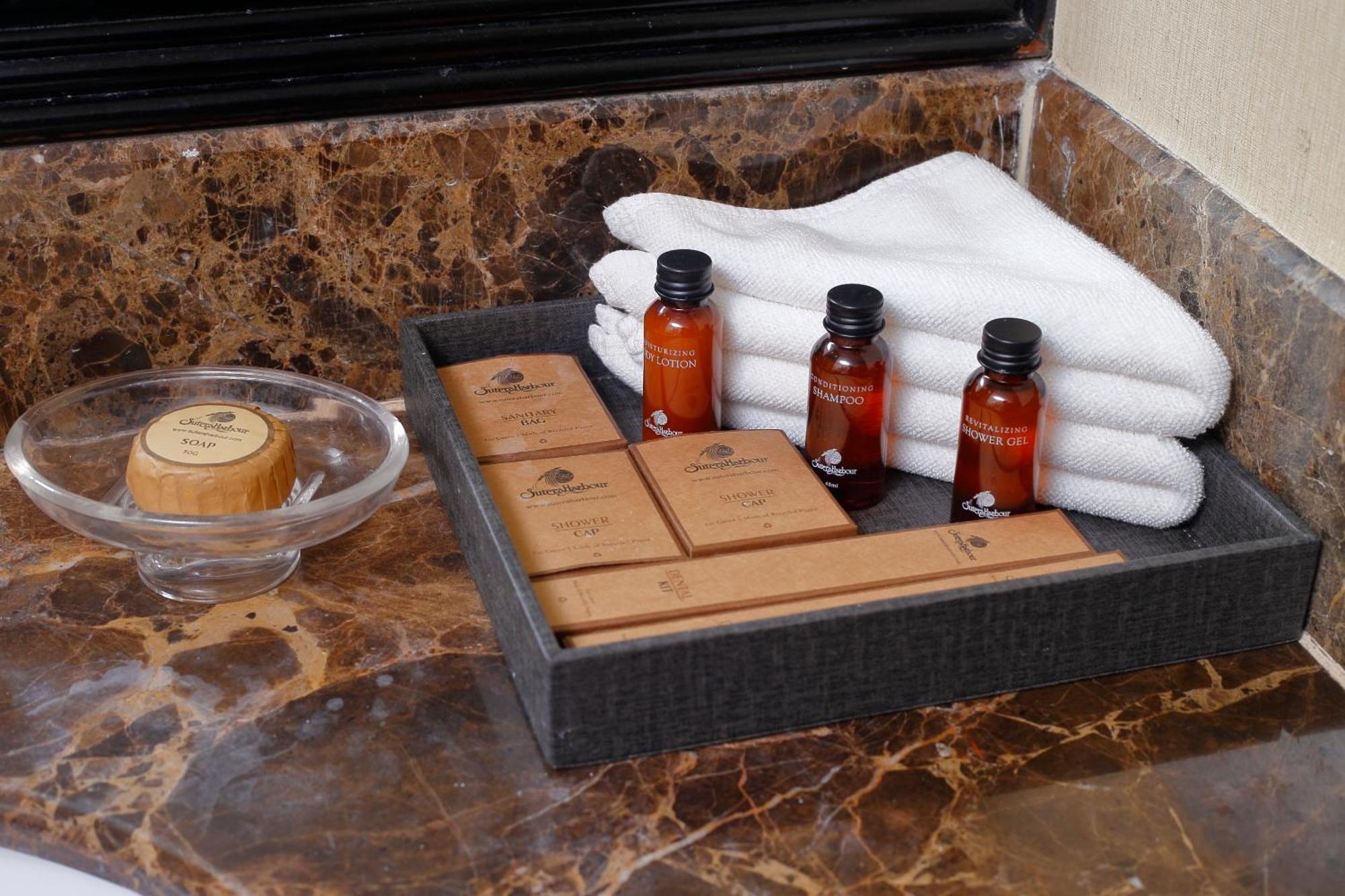 Отель The Pacific Sutera Кота-Кинабалу Экстерьер фото A selection of toiletries in a hotel bathroom